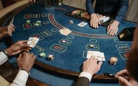 Live dealer studio with multiple camera angles showing roulette wheel and player chat interface